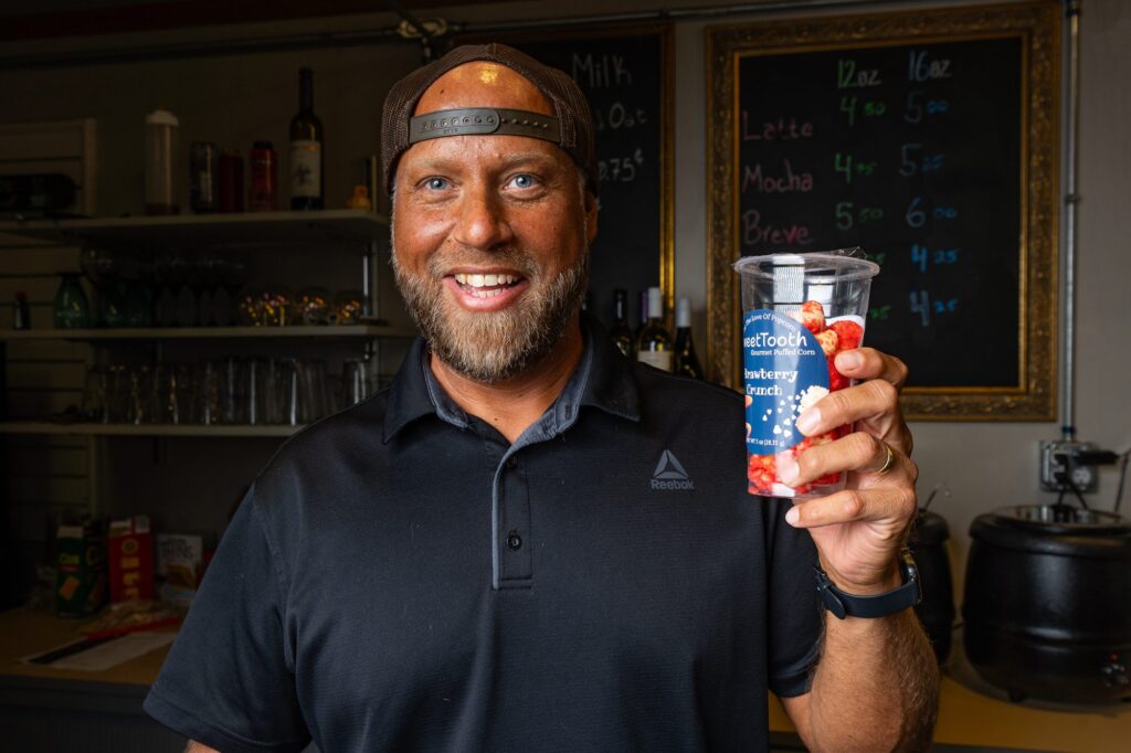 Frank holding a drink at the espresso bar