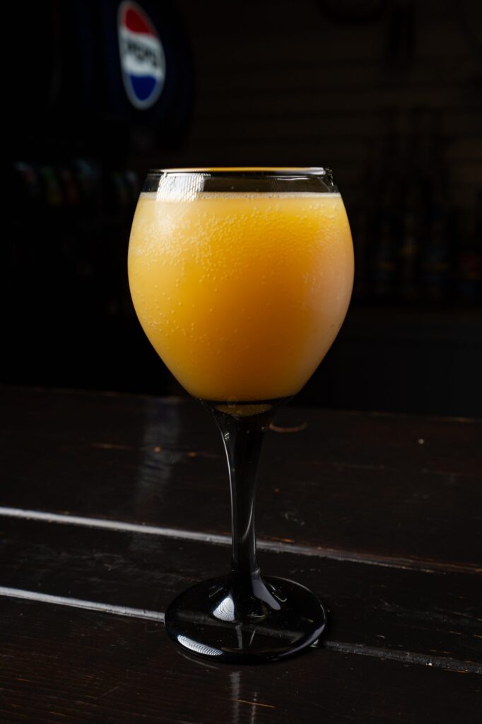 Mimosa in a stemmed glass at the cafe bar