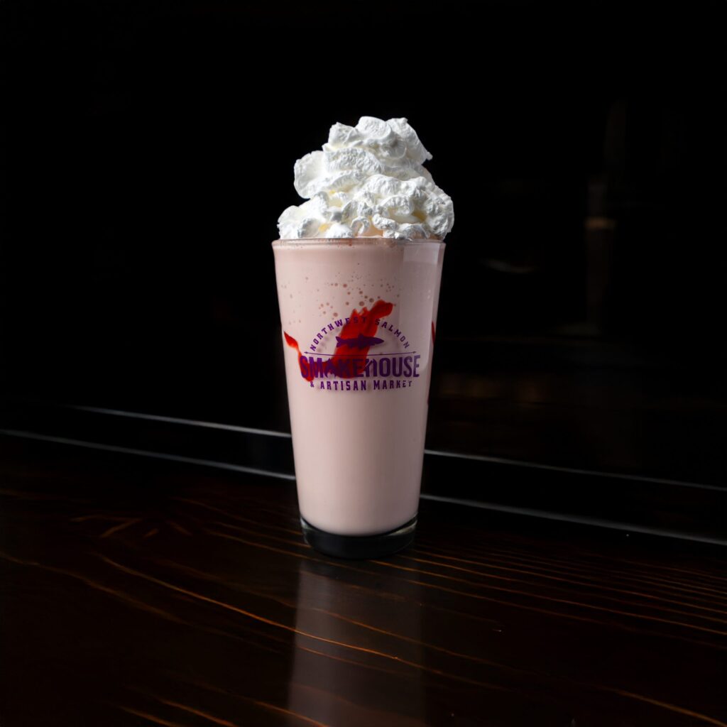 Strawberry milkshake with whipped cream in a Smokehouse cup